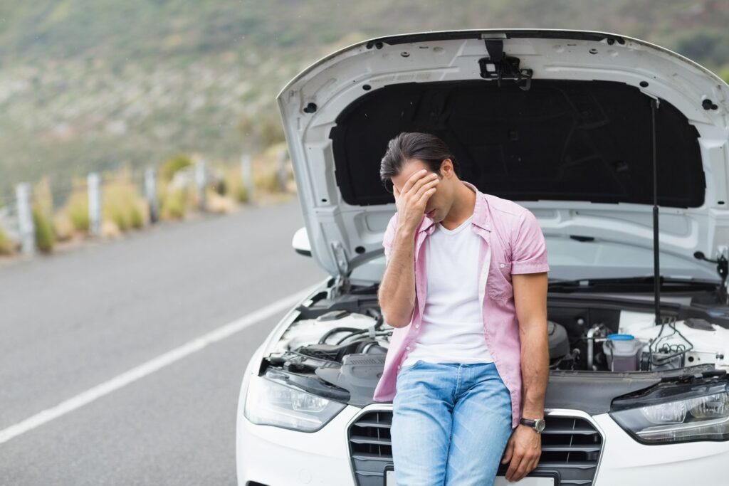 man stand in front of car 